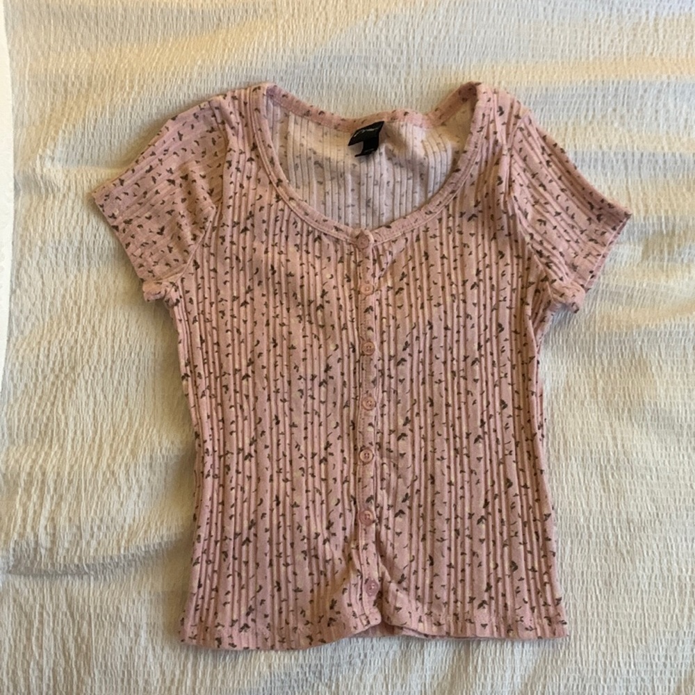Pink shirt with flowers on it